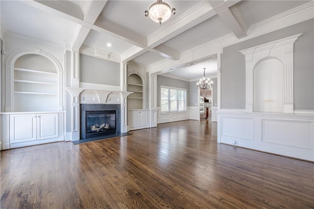 unfurnished living room with a fireplace with flush hearth, coffered ceiling, beam ceiling, and built in shelves