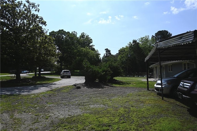 1621 Oak Rd, Snellville, GA 30078 - view of grassy yard with a carport