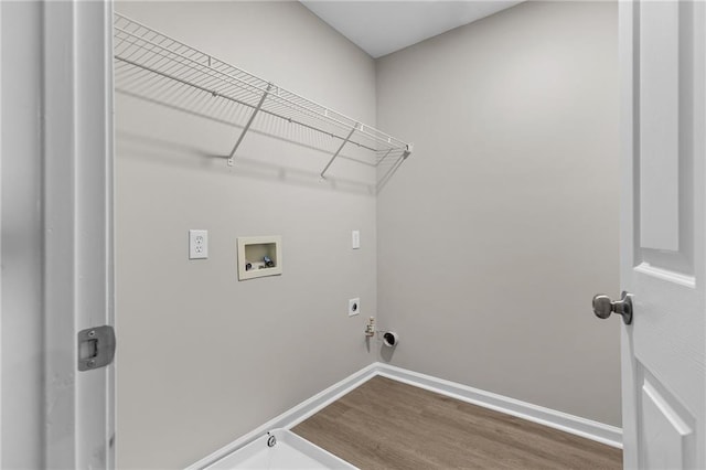 washroom featuring laundry area, washer hookup, wood finished floors, and hookup for an electric dryer