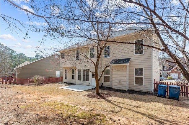 back of house featuring a patio area and fence