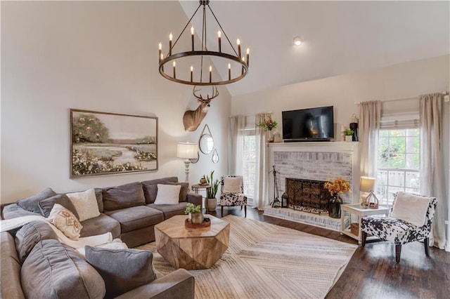 living room featuring a brick fireplace, dark wood-type flooring, and vaulted ceiling