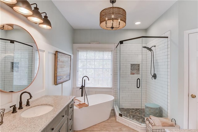 bathroom with vanity and plus walk in shower