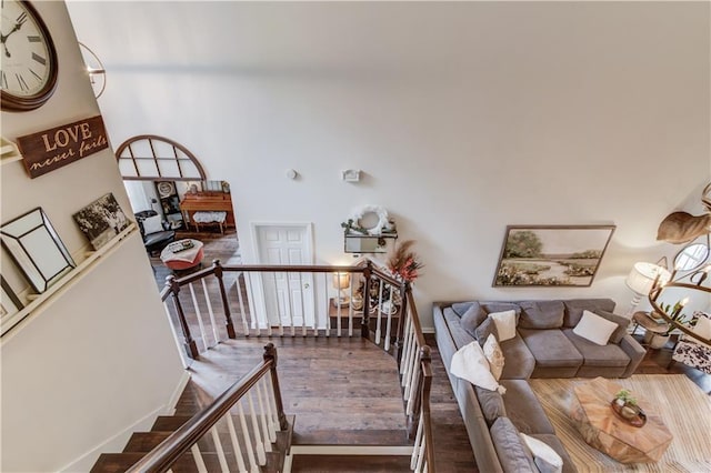 stairway with hardwood / wood-style floors