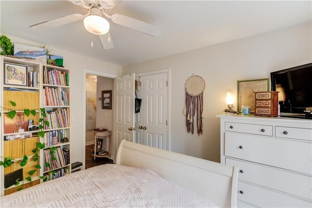 bedroom with ceiling fan and a closet