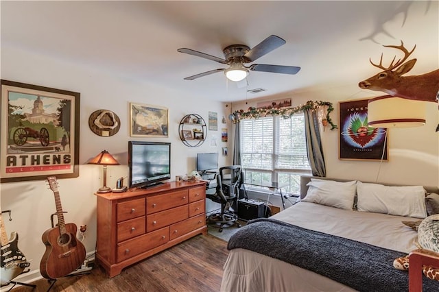 bedroom with dark wood-type flooring and ceiling fan