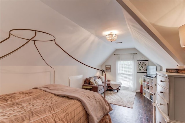 bedroom featuring lofted ceiling and dark hardwood / wood-style floors