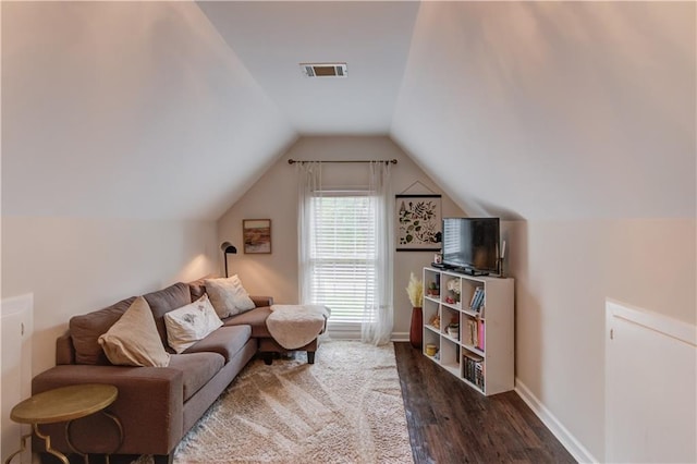 interior space with dark hardwood / wood-style flooring and vaulted ceiling