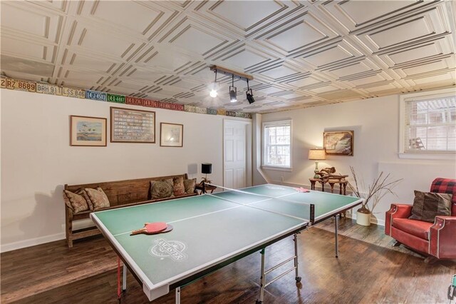 playroom with dark wood-type flooring