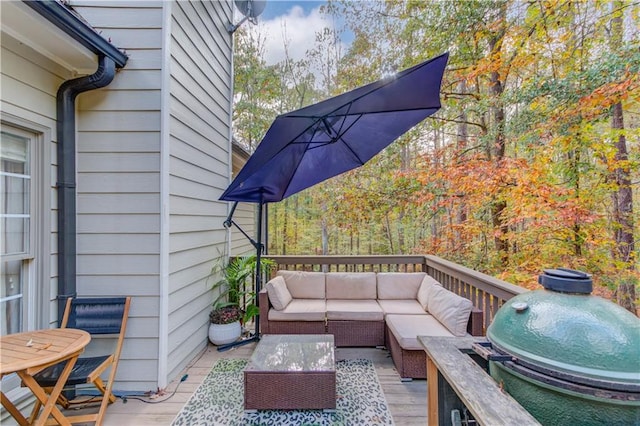 deck with grilling area and an outdoor hangout area