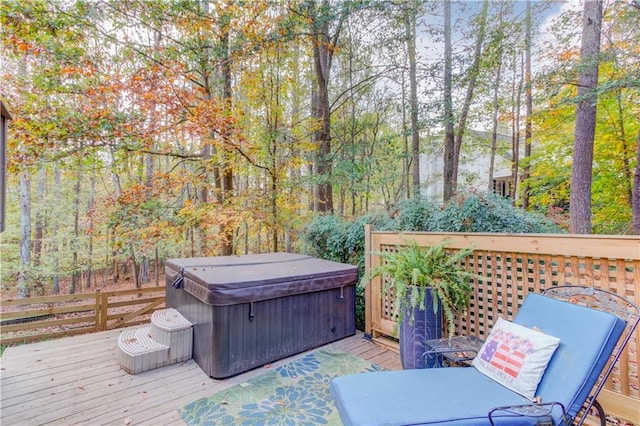 wooden terrace featuring a hot tub