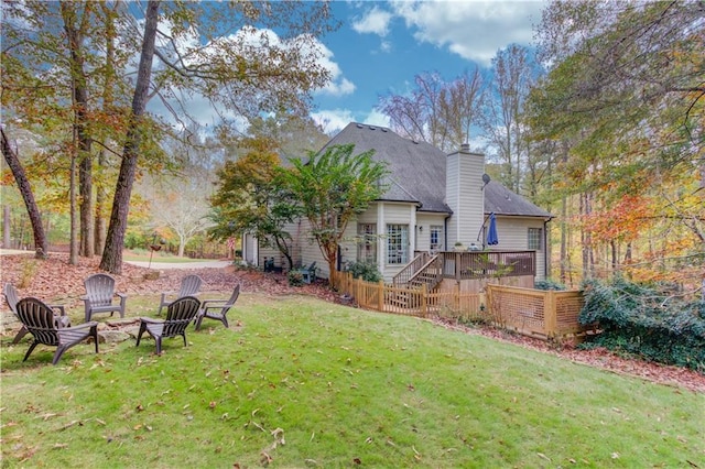 view of yard featuring an outdoor fire pit