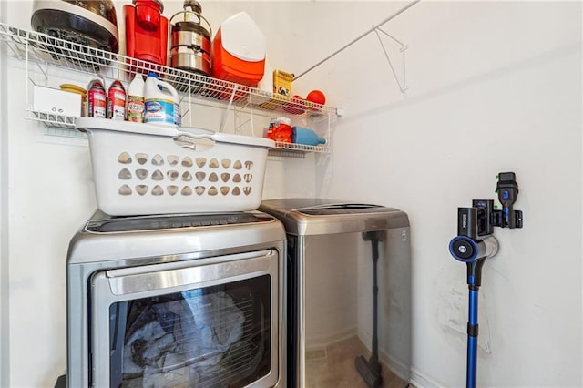 clothes washing area with washer and dryer