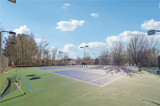 view of tennis court featuring basketball court