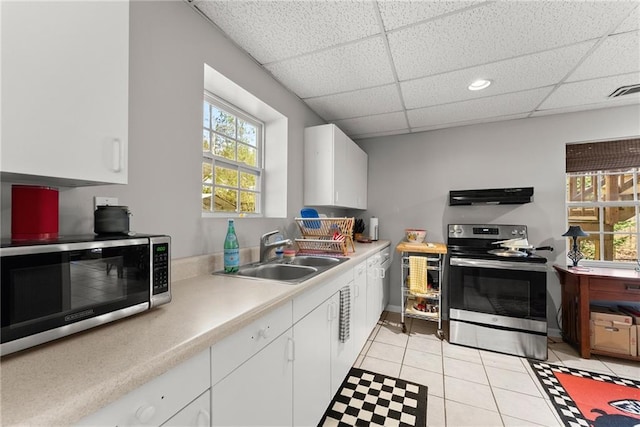 165 Grant Ford Dr, Dawsonville, GA 30534 - kitchen with appliances with stainless steel finishes, a sink, exhaust hood, light countertops, and a paneled ceiling
