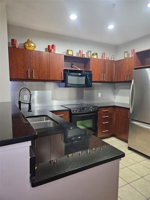 kitchen featuring light tile patterned floors, dark stone counters, recessed lighting, a sink, and black appliances