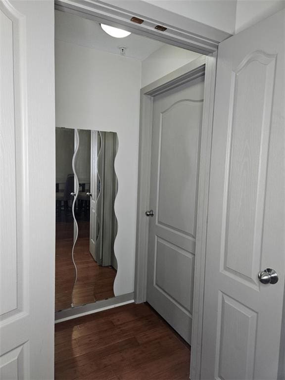 hallway with wood finished floors