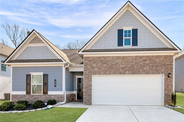 craftsman-style home featuring central AC, a garage, and a front lawn