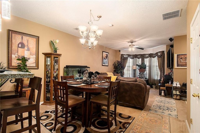 7324 Bridlewood Ct, Jonesboro, GA 30236 - dining area with a textured ceiling, a chandelier, and a ceiling fan