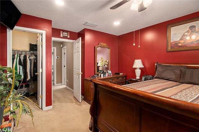7324 Bridlewood Ct, Jonesboro, GA 30236 - bedroom featuring light colored carpet, a closet, ceiling fan, and a textured ceiling
