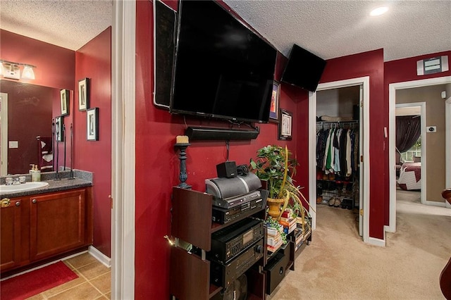 7324 Bridlewood Ct, Jonesboro, GA 30236 - bedroom with a textured ceiling, a closet, and light carpet