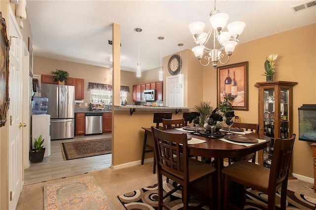 7324 Bridlewood Ct, Jonesboro, GA 30236 - dining area featuring a chandelier