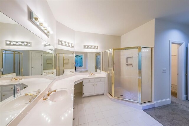 bathroom with vanity, tile patterned floors, and a shower stall