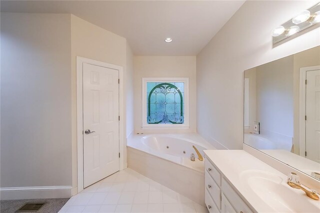 full bath with a jetted tub, vanity, and visible vents
