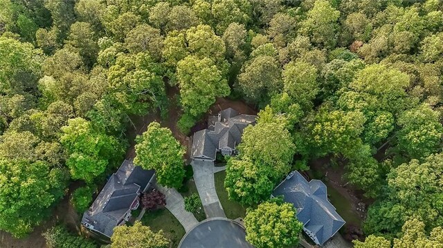 bird's eye view featuring a forest view