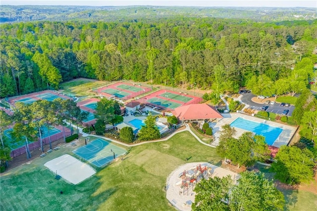 drone / aerial view featuring a view of trees