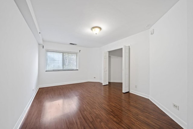 1501 Clairmont Rd Unit 223, Decatur, GA 30033 - unfurnished bedroom featuring dark wood-type flooring