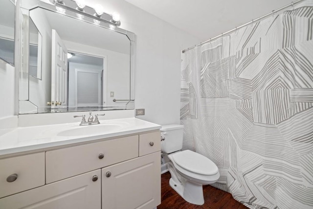 1501 Clairmont Rd Unit 223, Decatur, GA 30033 - bathroom with vanity, wood-type flooring, and toilet