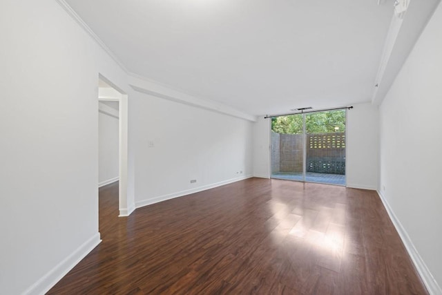 1501 Clairmont Rd Unit 223, Decatur, GA 30033 - spare room with crown molding, dark wood-type flooring, and expansive windows