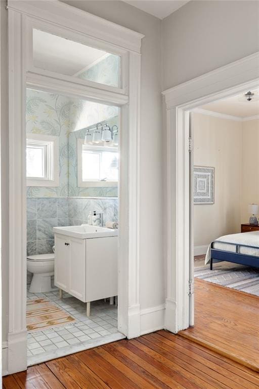 bathroom with vanity, hardwood / wood-style floors, and toilet