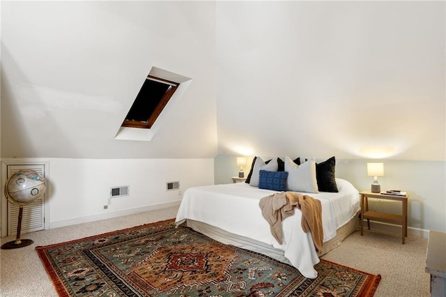 bedroom with carpet flooring and lofted ceiling with skylight