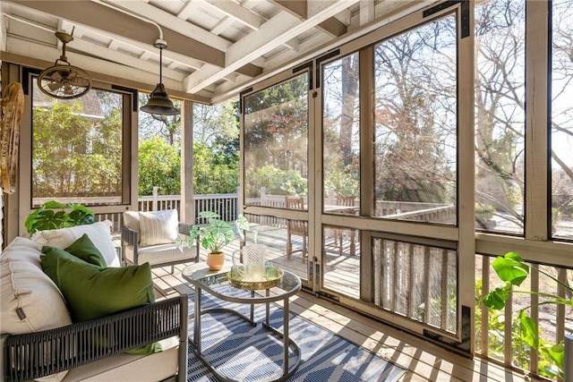 sunroom with beam ceiling