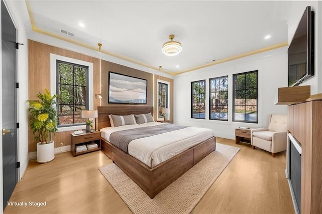 unfurnished living room with recessed lighting, a fireplace, light wood-style floors, and a healthy amount of sunlight