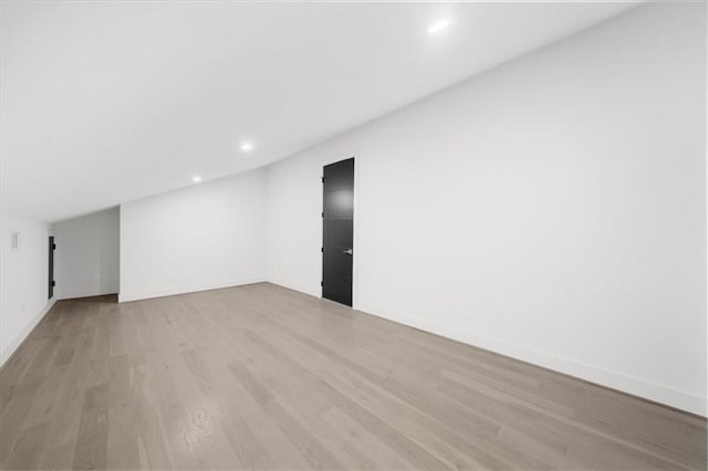 interior space featuring wood finished floors, visible vents, and recessed lighting