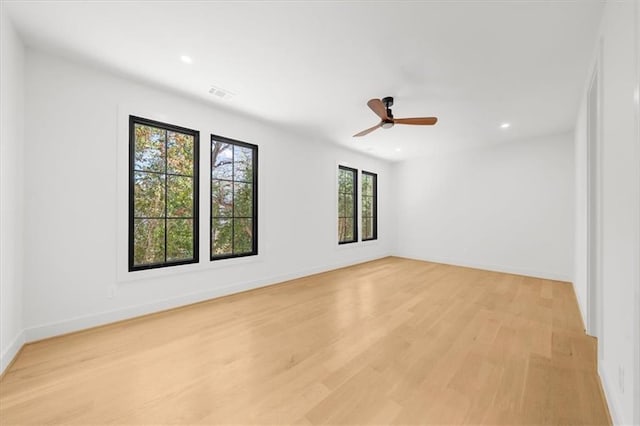 unfurnished room with light wood-style flooring, baseboards, visible vents, recessed lighting, and a ceiling fan
