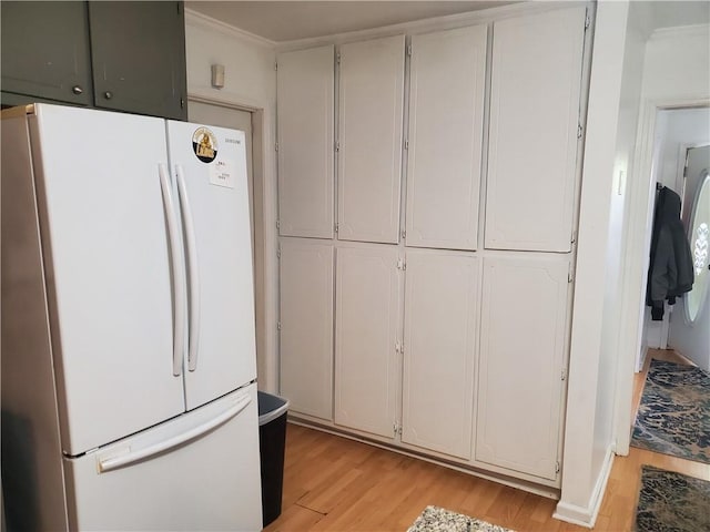 3905 Hunters Chase, Conyers, GA 30094 - kitchen with freestanding refrigerator and light wood finished floors
