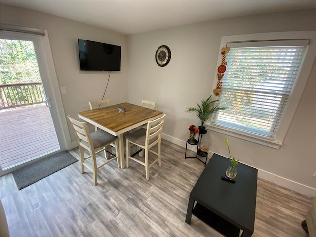 dining area with light wood-type flooring