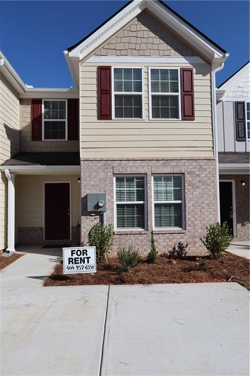 view of front of home with brick siding