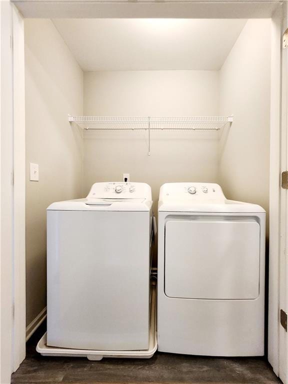 laundry area with laundry area and independent washer and dryer