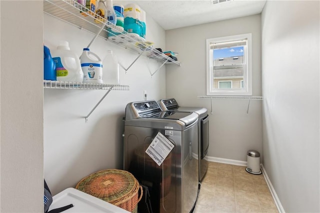3698 Roseman Lndg, Cumming, GA 30040 - washroom featuring washer and clothes dryer, baseboards, and light tile patterned floors