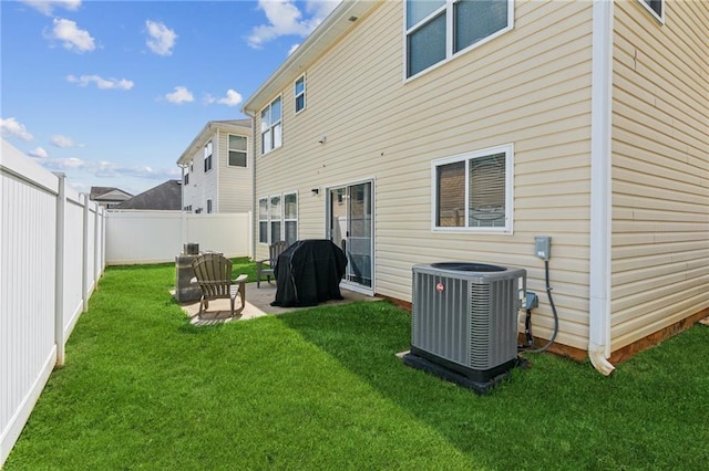 3698 Roseman Lndg, Cumming, GA 30040 - rear view of house with central air condition unit and a patio