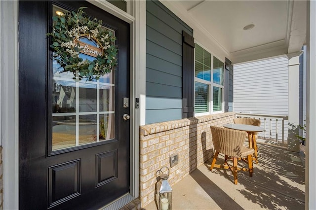 entrance to property featuring a porch