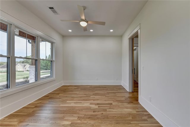 empty room featuring ceiling fan and light wood-type flooring