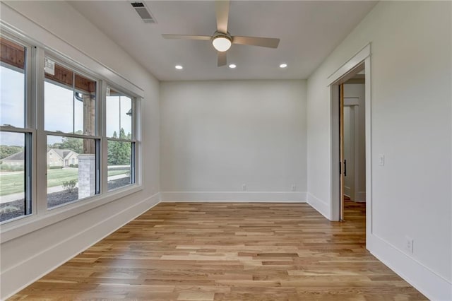 spare room with ceiling fan and light hardwood / wood-style floors