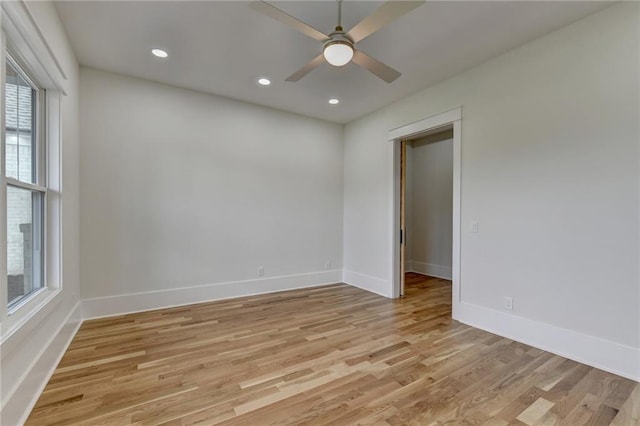 unfurnished room with ceiling fan and light wood-type flooring