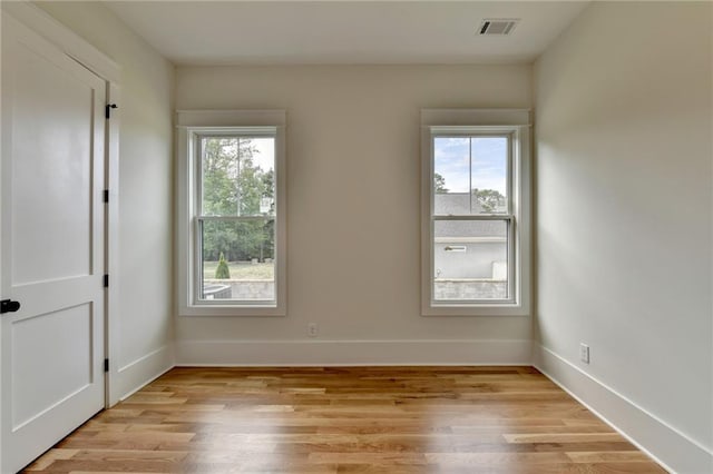 spare room featuring light hardwood / wood-style flooring