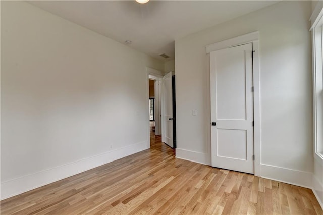 unfurnished bedroom featuring light wood-type flooring